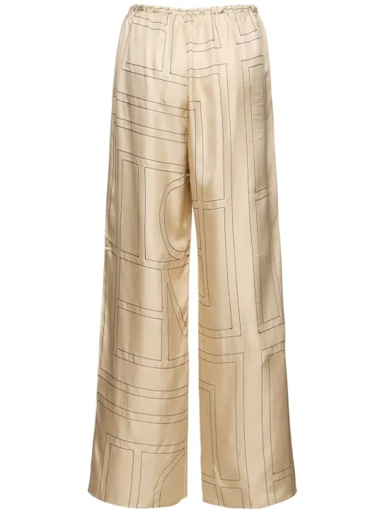 Toteme   Monogram embroidered silk pants 