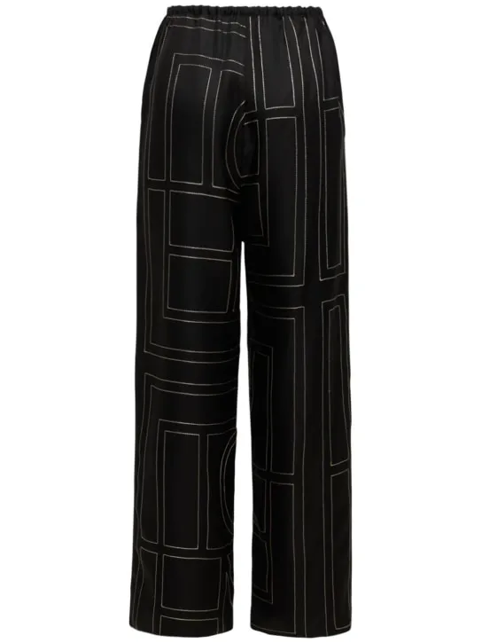 Toteme   Monogram embroidered silk pants 