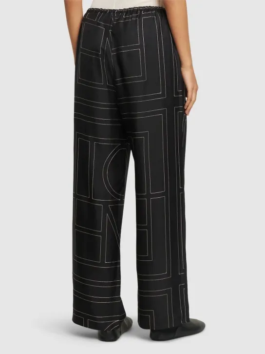 Toteme   Monogram embroidered silk pants 