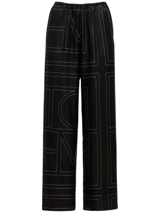 Toteme   Monogram embroidered silk pants 