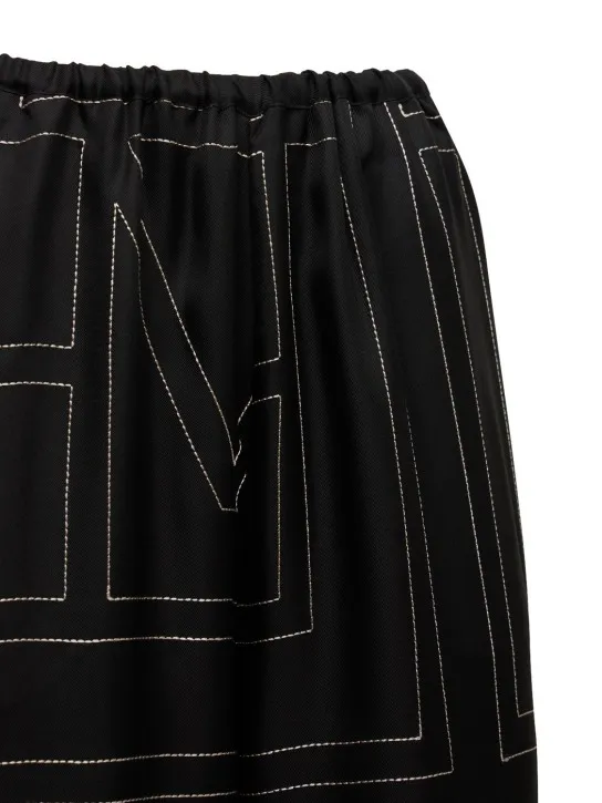 Toteme   Monogram embroidered silk pants 